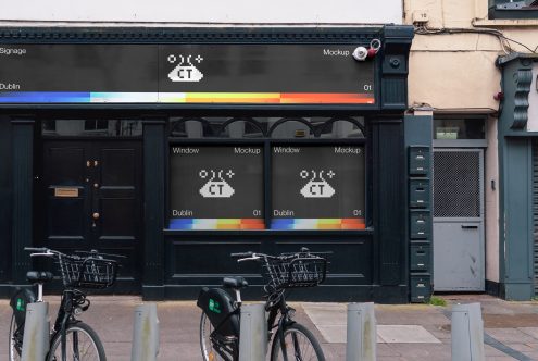 Urban storefront mockup featuring a sleek black storefront design with pixelated signage ideal for presentations and branding projects.